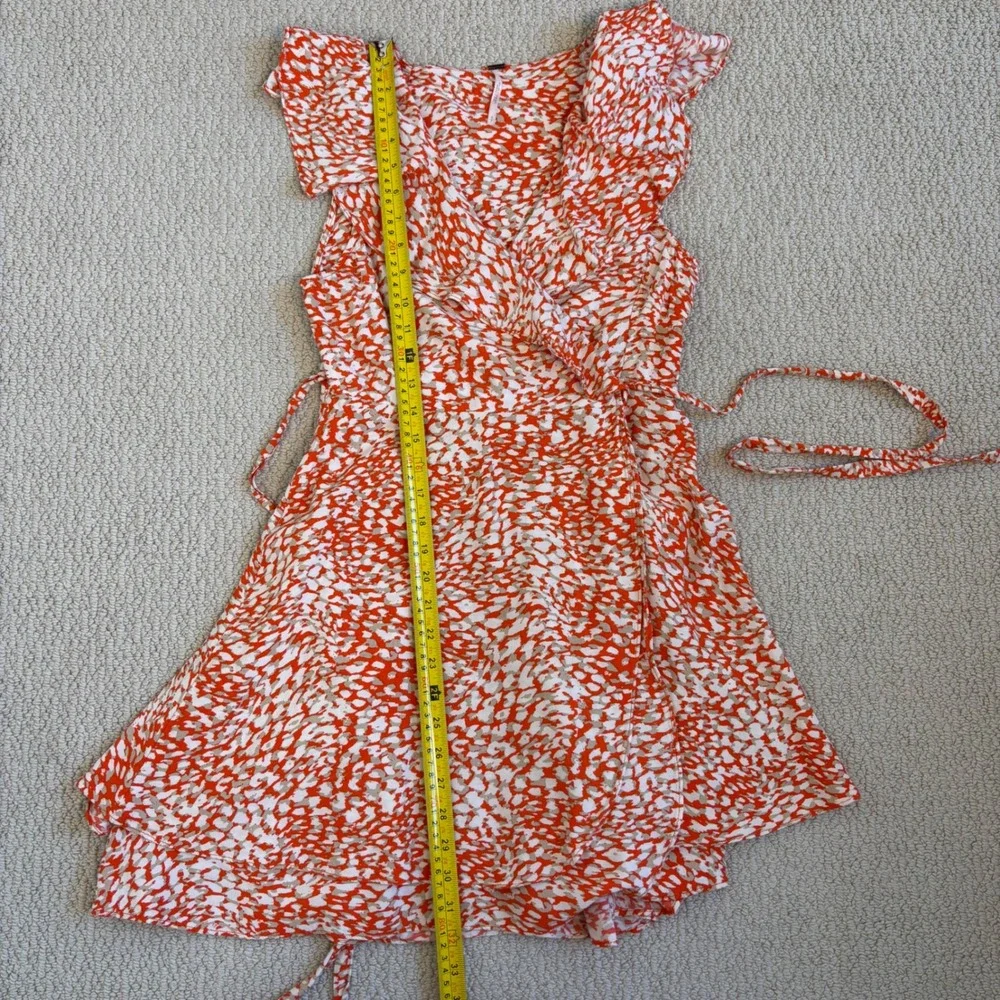 Free People French Quarter mini wrap dress, Small Orange White Animal Print boho